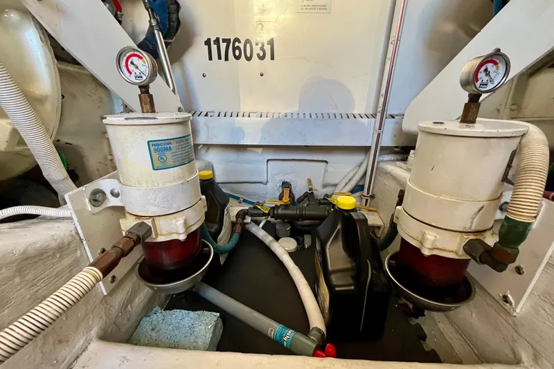 Slide: The Image of Engine room of a 2006 Bertram 390 Convertible, showcasing mechanical components and systems. - 51