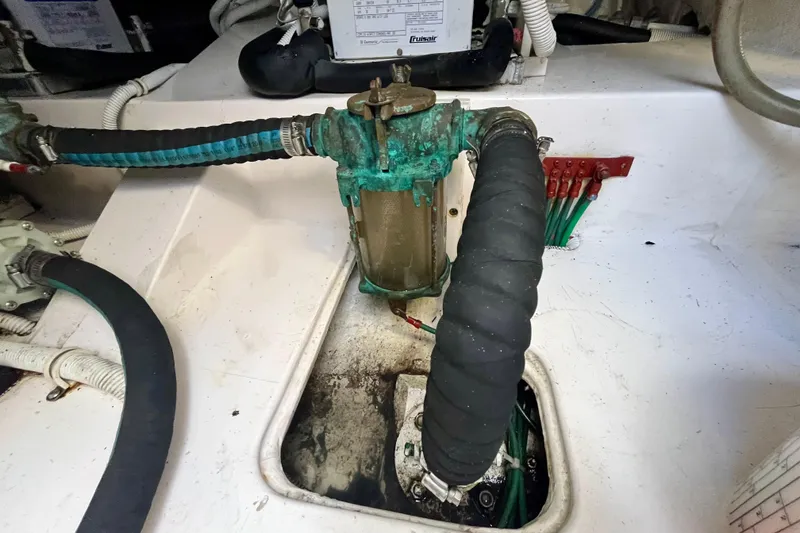 Slide: The Image of Engine room of 2006 Bertram 390 Convertible with fuel filters and gauges. - 52