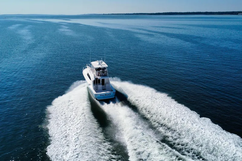 Slide: The Image of Engine room of a 2006 Bertram 390 Convertible with control panel and maintenance supplies. - 57