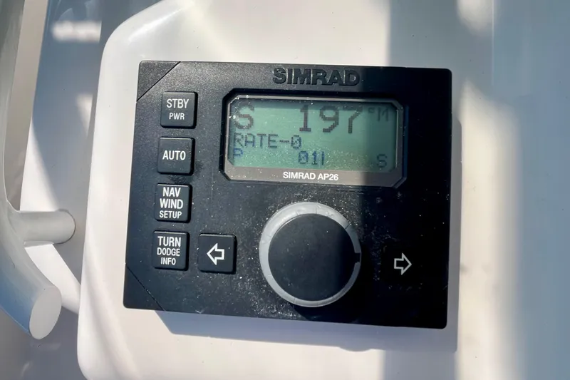 Slide: The Image of 2006 Bertram 390 Convertible yacht cruising on calm blue waters. - 60