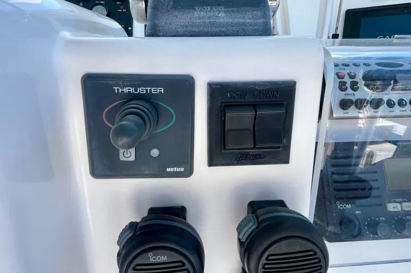 Slide: The Image of Garmin remote control on a 2006 Bertram 390 Convertible yacht dashboard. - 61