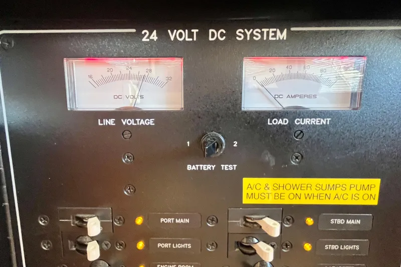 Slide: The Image of Battery compartment of a 2006 Bertram 390 Convertible boat, featuring Power-Tec battery and wiring. - 69