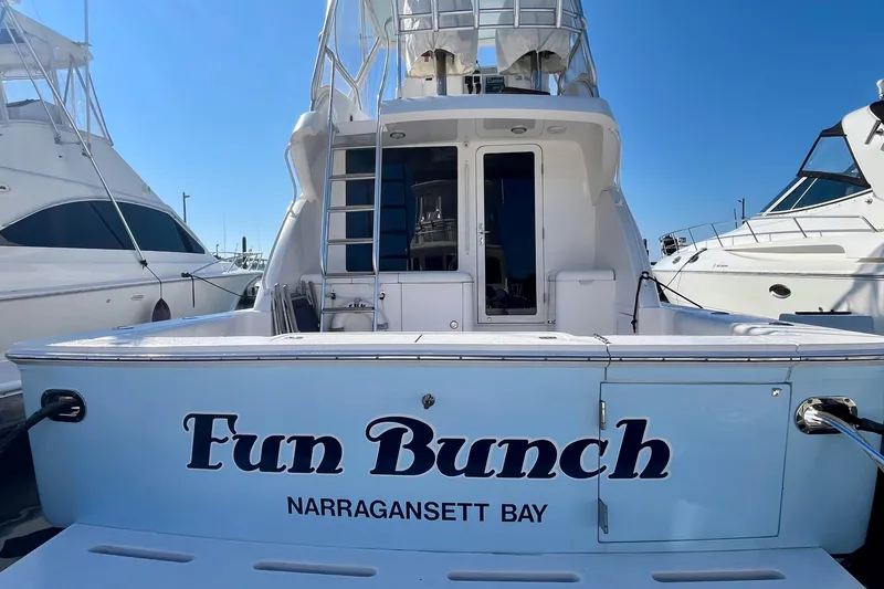 Slide: The Image of 2006 Bertram 390 Convertible yacht docked under clear blue sky. - 7
