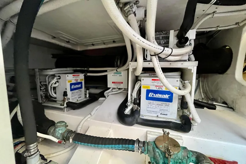Slide: The Image of Electrical panel of a 2006 Bertram 390 Convertible, showing AC voltage and amperage meters. - 72