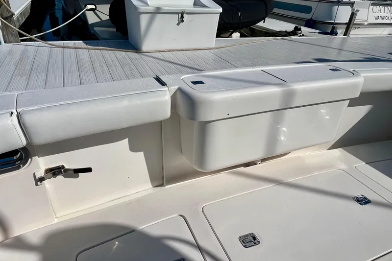 Slide: The Image of 2006 Bertram 390 Convertible yacht cockpit, docked with other boats in a marina. - 9