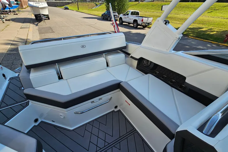 Slide: The Image of 2022 Cobalt R4 boat interior with white seating and modern design. - 10