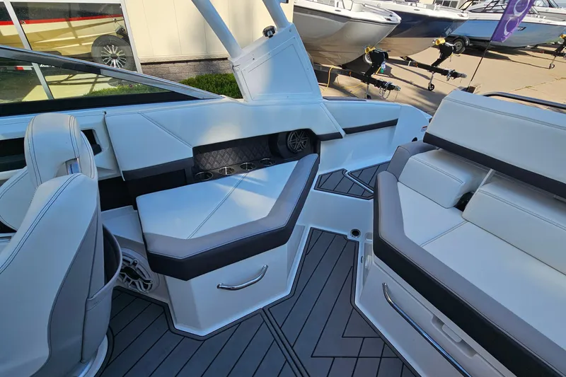 Slide: The Image of Interior of a 2022 Cobalt R4 boat showcasing sleek white seating and modern design. - 11