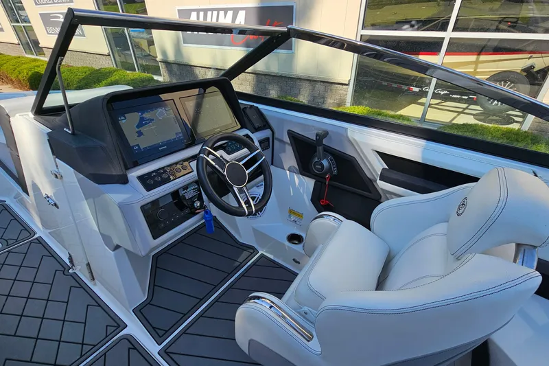 Slide: The Image of 2022 Cobalt R4 boat cockpit with modern steering and navigation displays. - 15