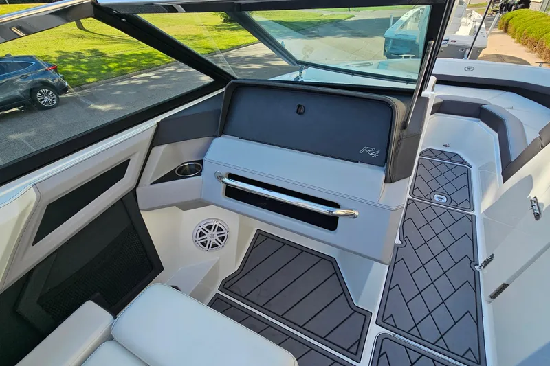 Slide: The Image of 2022 Cobalt R4 boat interior with sleek design, modern dashboard, and comfortable seating. - 17