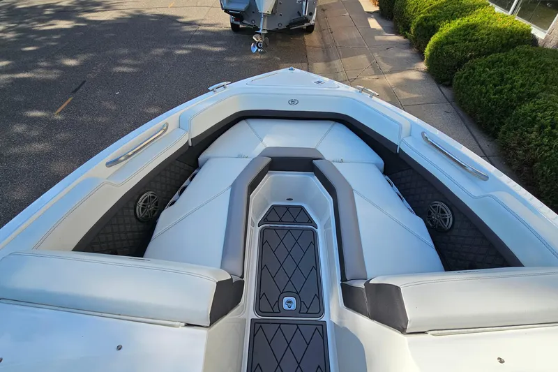 Slide: The Image of 2022 Cobalt R4 boat interior with cushioned seating and sleek design. - 18