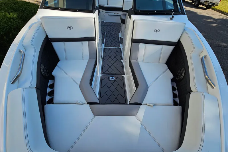 Slide: The Image of 2022 Cobalt R4 boat interior with white seating and sleek design. - 19