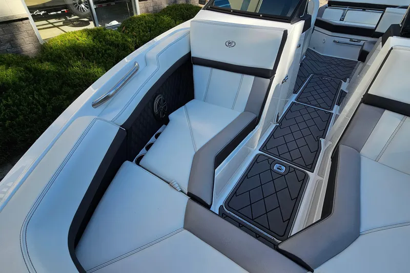 Slide: The Image of 2022 Cobalt R4 boat interior with white and gray seating, modern design. - 21