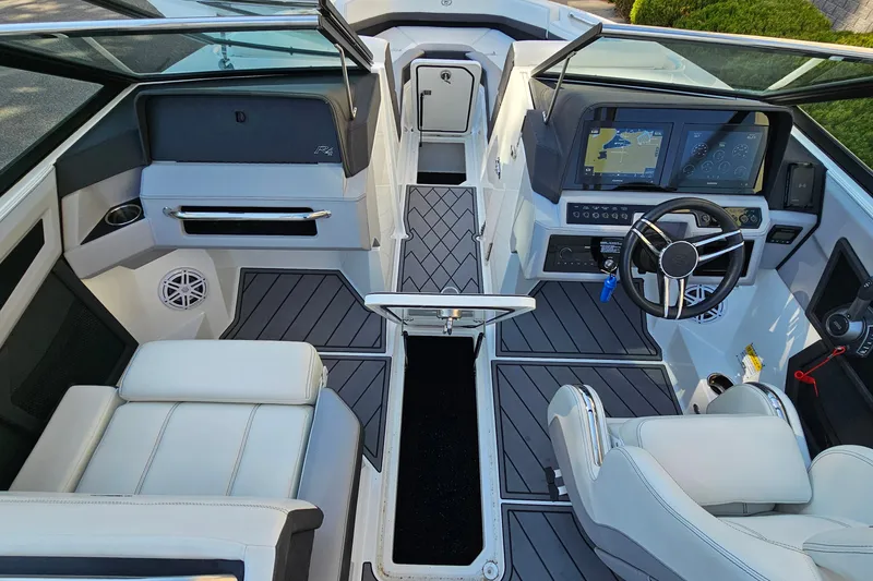Slide: The Image of 2022 Cobalt R4 boat interior with modern dashboard and seating. - 23