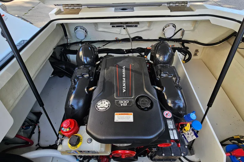 Slide: The Image of 2022 Cobalt R4 boat engine compartment featuring a Volvo Penta 300 V8 engine. - 27