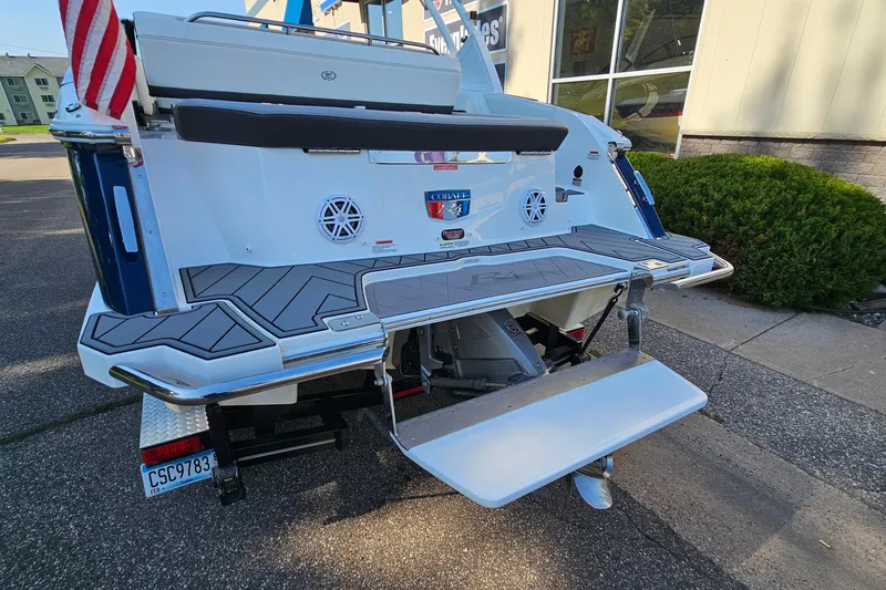 Slide: The Image of 2022 Cobalt R4 boat rear view with swim platform and American flag. - 6
