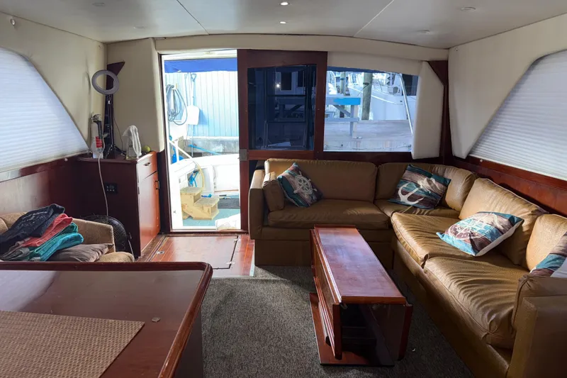 Slide: The Image of Interior of 1988 Ocean Convertible yacht with cozy seating and nautical decor. - 10