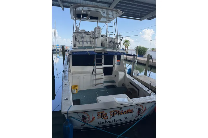 Slide: The Image of 1988 Ocean Convertible boat docked in Galveston, Texas marina. - 3