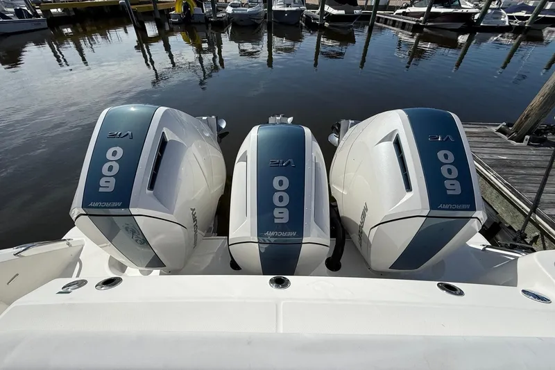 Slide: The Image of Triple Mercury 600 V12 engines on 2024 Boston Whaler 420 Outrage at dock. - 10