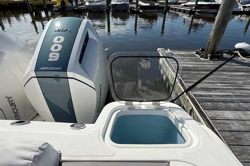 Slide: The Image of 2024 Boston Whaler 420 Outrage with Mercury 600 engine at dockside. - 11