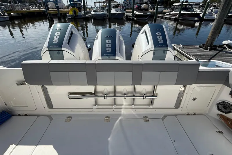 Slide: The Image of 2024 Boston Whaler 420 Outrage with triple Mercury 600 engines at marina. - 12