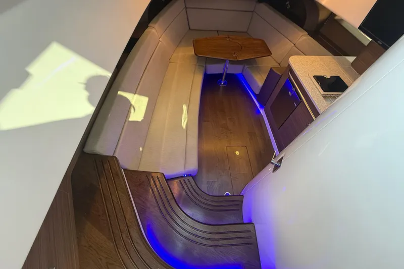 Slide: The Image of Luxurious interior of 2024 Boston Whaler 420 Outrage with elegant seating and ambient lighting. - 36