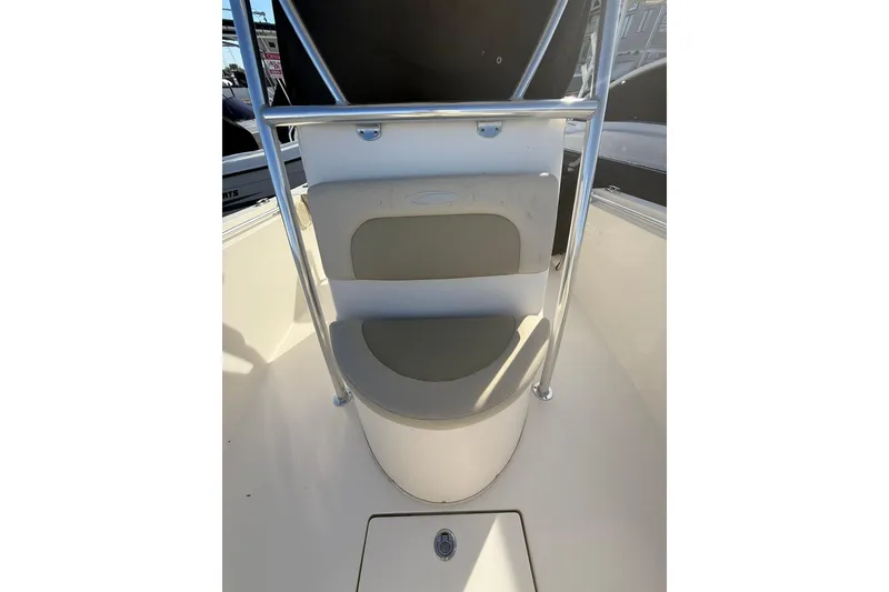 Slide: The Image of 2013 Cobia 237 Center Console boat seat with stainless steel railing. - 18