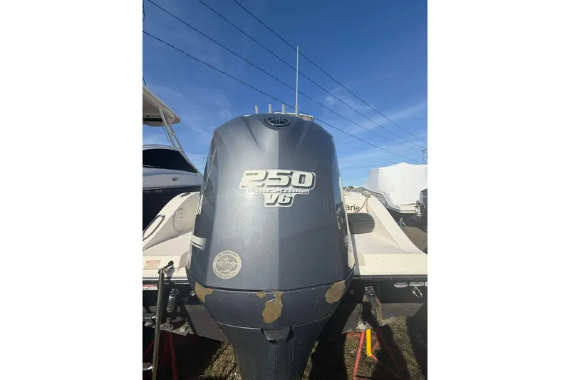 Slide: The Image of 2013 Cobia 237 Center Console with Yamaha 250 V6 outboard engine. - 4