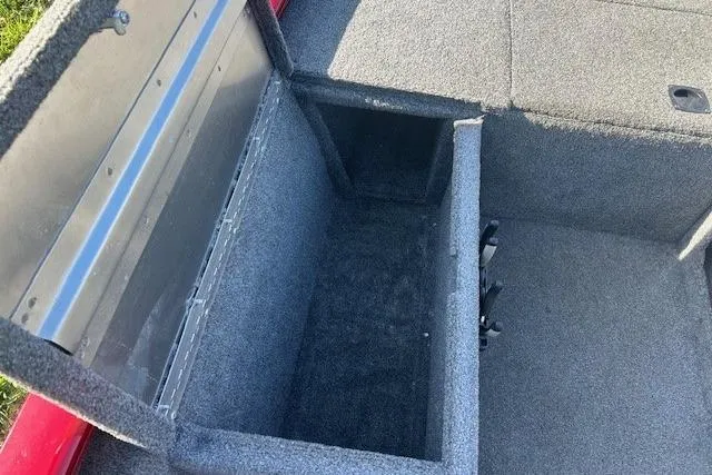 Slide: The Image of 2025 Tracker Pro 170 boat storage compartment with open lid, showcasing spacious interior. - 10