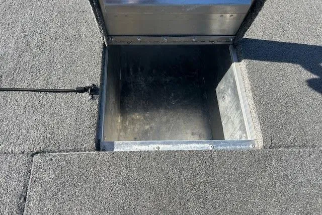 Slide: The Image of Open storage compartment on 2025 Tracker Pro 170 boat deck. - 11