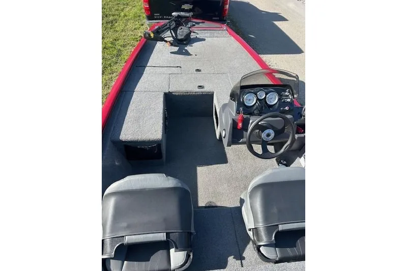 Slide: The Image of 2025 Tracker Pro 170 boat interior with steering console and seating. - 4