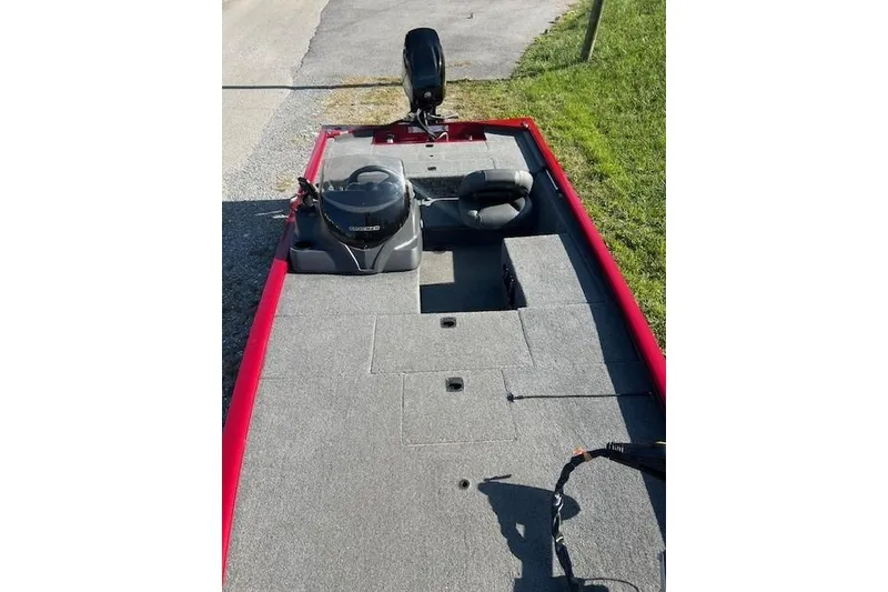 Slide: The Image of 2025 Tracker Pro 170 boat interior with gray carpet and seating. - 7