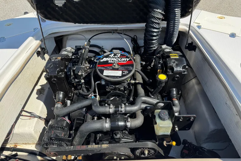 Slide: The Image of Engine compartment of a 2008 Tahoe 195 boat with a 4.3L MerCruiser engine. - 10