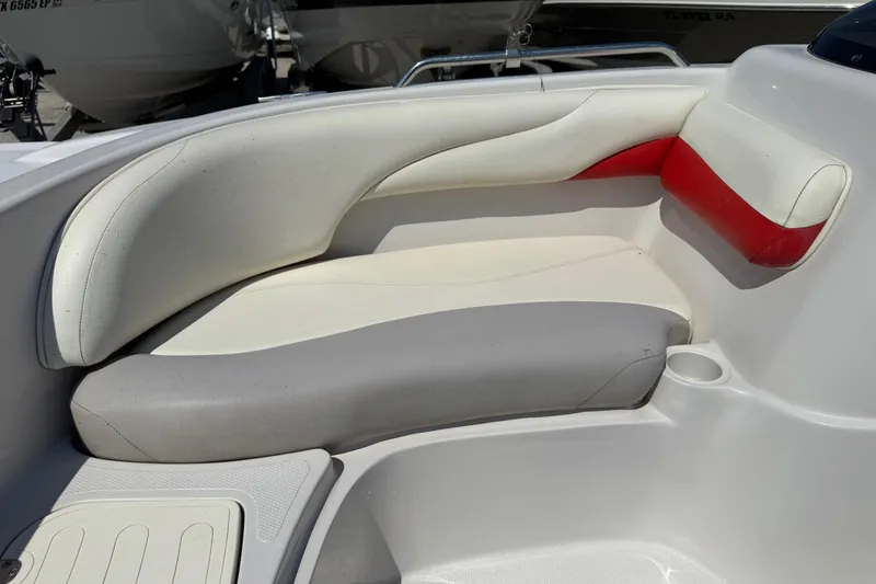 Slide: The Image of 2008 Tahoe 195 boat interior with white, gray, and red cushioned seating. - 16
