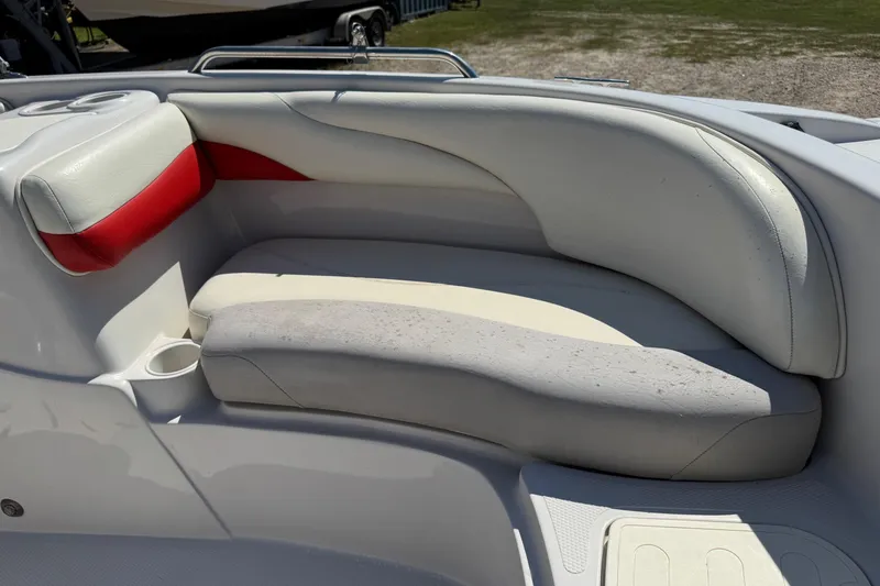Slide: The Image of 2008 Tahoe 195 boat interior with white and red cushioned seating. - 17