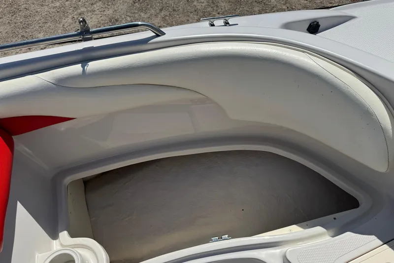 Slide: The Image of Interior of a 2008 Tahoe 195 boat showing seating and storage area. - 18