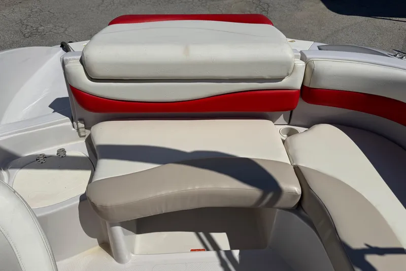 Slide: The Image of 2008 Tahoe 195 boat interior seating with red and white upholstery. - 6