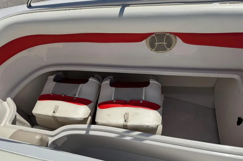 Slide: The Image of 2008 Tahoe 195 boat interior with red and white seating and speaker. - 9