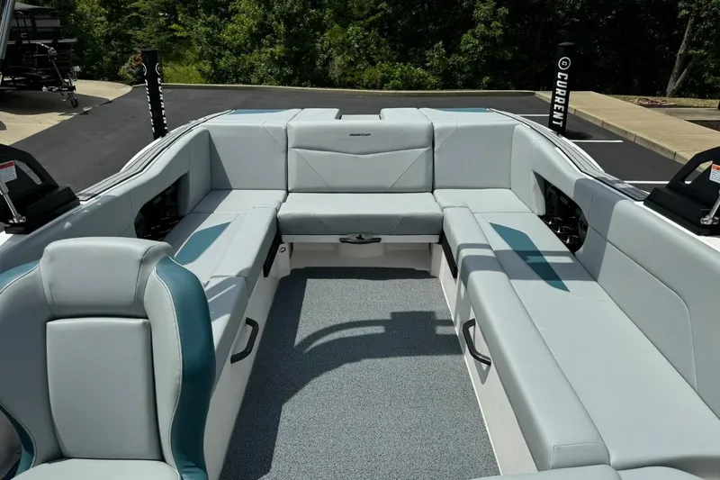 Slide: The Image of 2025 MasterCraft NXT24 boat interior with spacious seating and modern design. - 11