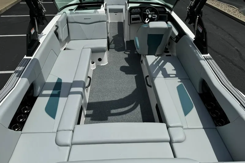 Slide: The Image of 2025 MasterCraft NXT24 boat interior with spacious seating and modern design. - 12