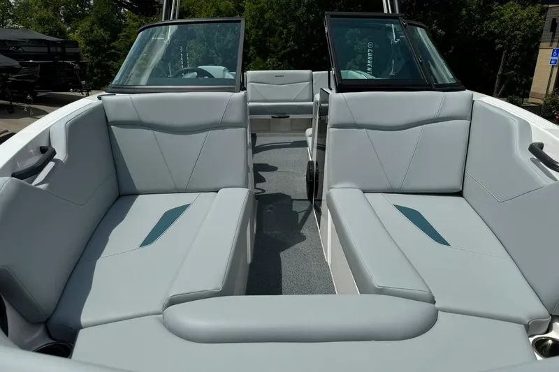 Slide: The Image of 2025 MasterCraft NXT24 boat interior with sleek gray seating and modern design. - 7