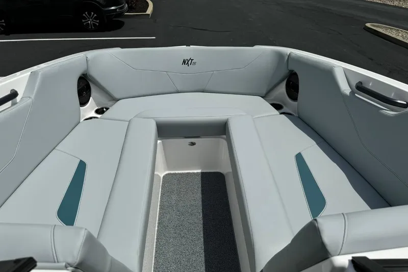 Slide: The Image of 2025 MasterCraft NXT24 boat interior with sleek seating and modern design. - 8