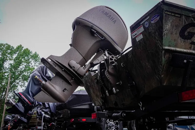 Slide: The Image of Boat with Yamaha outboard motor, G3 17SC model, 2026, parked outdoors. - 12