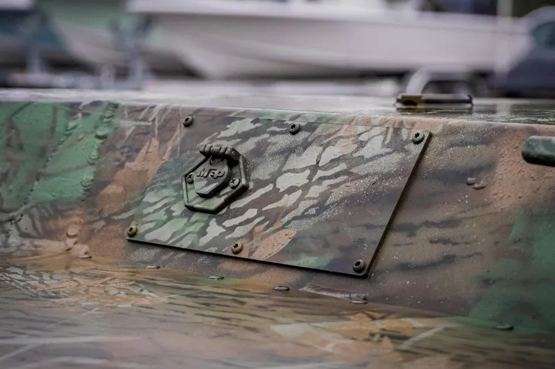 Slide: The Image of Camouflage-patterned G3 17SC boat detail, 2026 model, with textured surface and metal plate. - 14