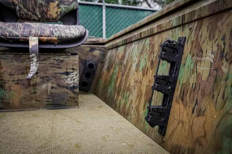 Slide: The Image of Camouflage interior of 2026 G3 17SC boat with seat and rod holder. - 17