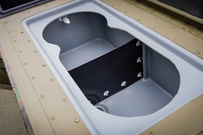 Slide: The Image of Open storage compartment in 2026 G3 17SC model boat. - 21