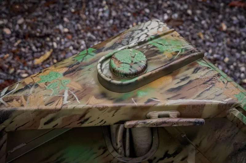 Slide: The Image of Camouflage-patterned G3 17SC vehicle part, 2026 model, on gravel background. - 25