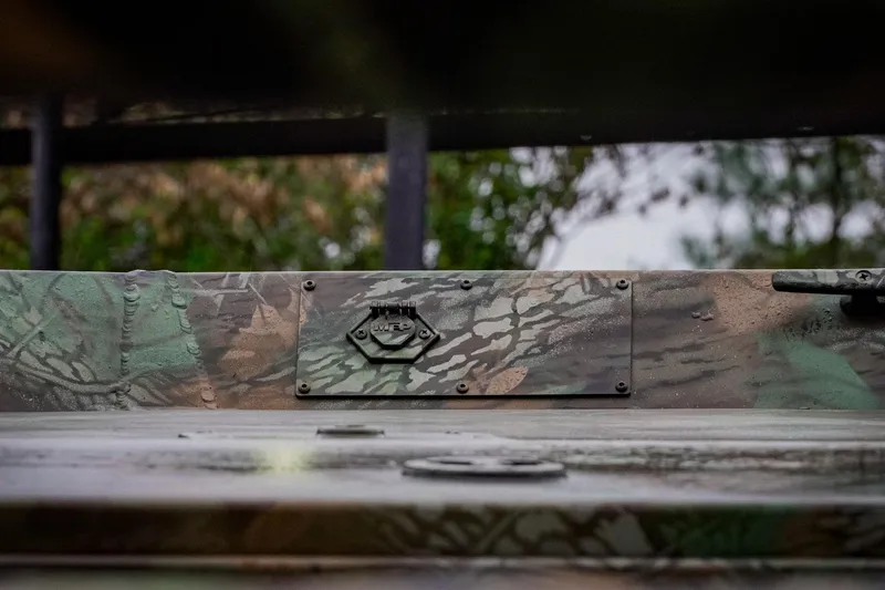 Slide: The Image of Camouflaged G3 17SC vehicle detail, 2026 model, with forest background. - 27