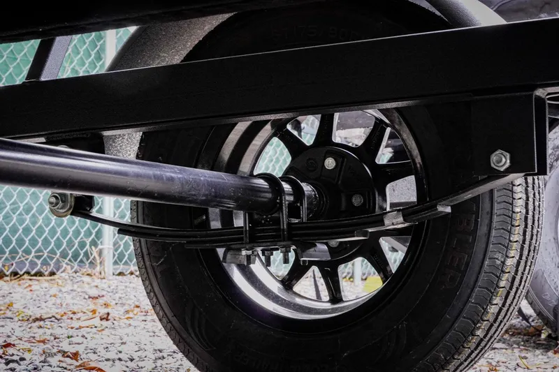 Slide: The Image of Close-up of a 2026 G3 17SC trailer wheel and suspension system. - 30