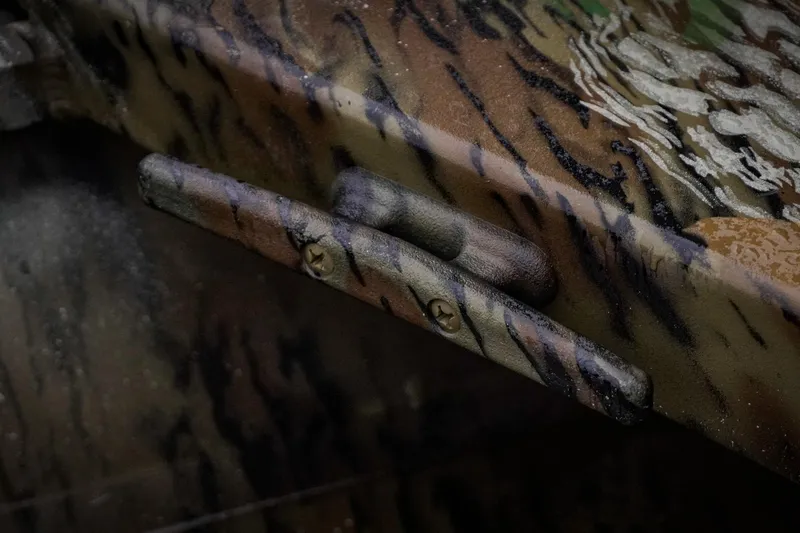 Slide: The Image of Camouflage-patterned detail on G3 17SC model, 2026, featuring textured surface and screws. - 31