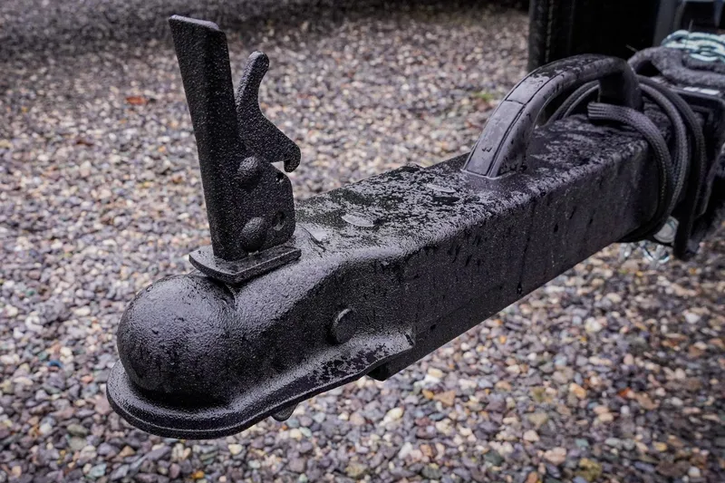 Slide: The Image of Trailer hitch of G3 17SC 2026 model on gravel surface, wet and textured. - 33